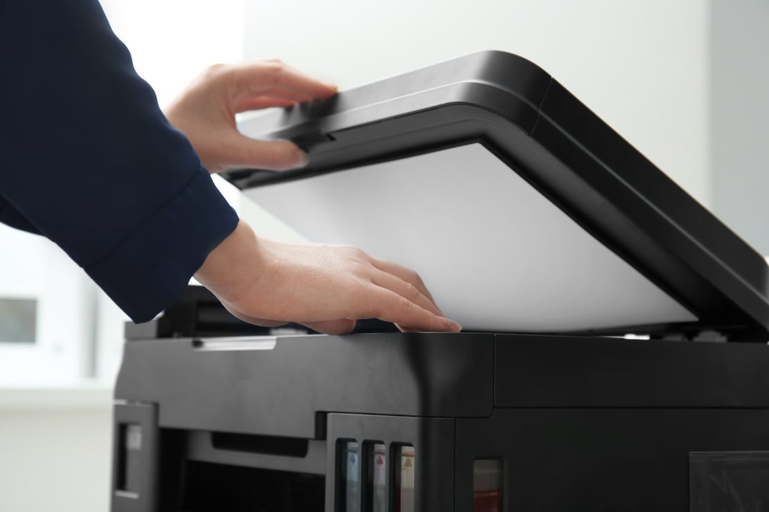 Woman Using a Photocopy Machine